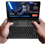 GPD WIN Mini 2024: Powerful handheld gaming PC with 7" FHD 120Hz VRR display. Features AMD Ryzen 7 8840U, 32GB RAM, 2TB NVMe storage. Clamshell design combines full QWERTY keyboard with gaming controls, including dual joysticks and buttons. Compact form factor held comfortably in hands. Screen displays game character with glowing sword, showcasing vibrant graphics. Specs visible: 7" screen, 120Hz VRR, Ryzen 7 8840U, 32GB RAM, 2TB storage. "HANDHELD PC - CLAMSHELL" emphasized. AMD Ryzen and Radeon logos present. Device offers portable gaming and productivity in one, bridging gap between handheld console and mini laptop.