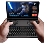 GPD WIN Mini 2024: Powerful handheld gaming PC with 7" FHD 120Hz VRR display. Features AMD Ryzen 7 8840U, 32GB RAM, 2TB NVMe storage. Clamshell design combines full QWERTY keyboard with gaming controls, including dual joysticks and buttons. Compact form factor held comfortably in hands. Screen displays game character with glowing sword, showcasing vibrant graphics. Specs visible: 7" screen, 120Hz VRR, Ryzen 7 8840U, 32GB RAM, 2TB storage. "HANDHELD PC - CLAMSHELL" emphasized. AMD Ryzen and Radeon logos present. Device offers portable gaming and productivity in one, bridging gap between handheld console and mini laptop.