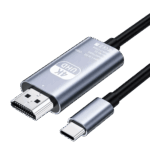 A studio photograph displays a metallic silver colored Type-C to HD adapter cable against a black background. The main body of the adapter features text in English: “4K UHD Type-C to HD Cable Model TH001 Rev: No.01 Made in China” alongside CE, WEEE, and FCC symbols. Connected to this metallic body are an HDMI male connector on one end and a black insulated cable on the opposite end. Additionally, a separate Type-C male connector, with its matching silver housing, is shown below the main body, also with its cable partially visible. All connections feature black heat shrink or plastic where the cables meet the connectors.