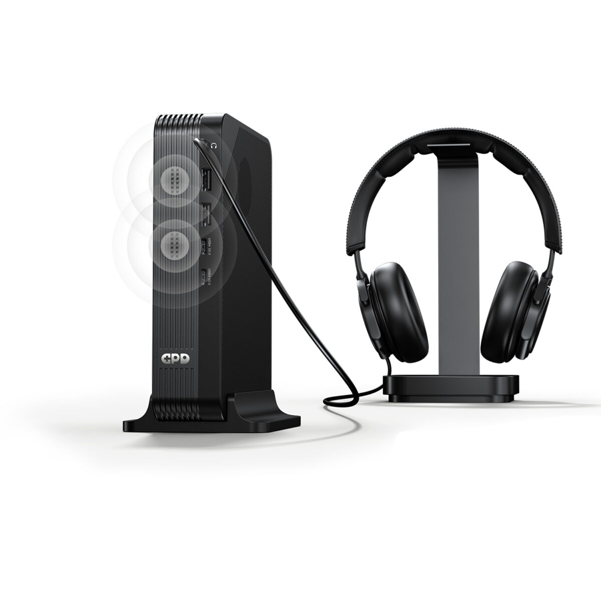 GPD-BOX-MARKETING-DONE-020 - GPD | PC Gaming Handhelds & Mini Laptops A marketing image showing the GPD device vertically docked. A cable connects its top audio jack to a pair of black over-ear headphones sitting on a stand. Faint white concentric circles emanate from the front of the unit, illustrating the built-in speaker functionality alongside the wired audio output.