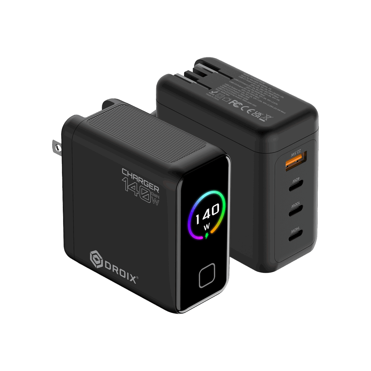 DROIX-140W-BLACK-DONE-01 - GPD | PC Gaming Handhelds & Mini Laptops A detailed product render of two DROIX 140W GaN Wall Chargers from different perspectives, displayed on a black background. The foreground charger is in a front-three-quarter view. It is a matte black block with its US foldable plug partially extended on the left side. On its side, prominent white text reads "CHARGER 140W" with a large "O" and a small "140" above the "O," and the DROIX logo below it. The front glossy black face features a central circular display with a dynamic rainbow-colored ring around the white text "140 W" and a small green charging icon. Below the display is a button or LED indicator. The background charger is in a rear-three-quarter view, showing the ports and text details. It lists extensive multi-line technical specifications and safety certifications in small white text (such as model numbers, voltage/current ratings, and CE, FCC, UKCA marks). This unit displays its four output ports: from top to bottom, one orange-accented USB-A port labeled with small text "22.5W Max," followed by three USB-C ports labeled in order "40W", "100W", and "140W". Both units show top ventilation grills. This composition provides a comprehensive view of the charger's branding, display, and port capabilities.
