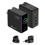 A detailed product graphic showing two views of the black DROIX 140W USB-C Wall Charger and its interchangeable international adapters. The top-left view displays the charger's matte black body with a glossy front screen. The display features a vibrant rainbow-colored circular ring around a "140 W" power indicator. The top-right view highlights the four output ports: three USB-C ports (labeled 40W, 100W, and 140W) and one orange USB-A port (22.5W). At the bottom, two snap-on travel adapters for UK and EU sockets are shown, highlighting the unit’s versatility for global travel.