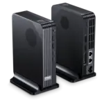 GPD BOX Mini PC pair in matte black, angled on stands with ribbed vents, USB ports and rear Ethernet visible