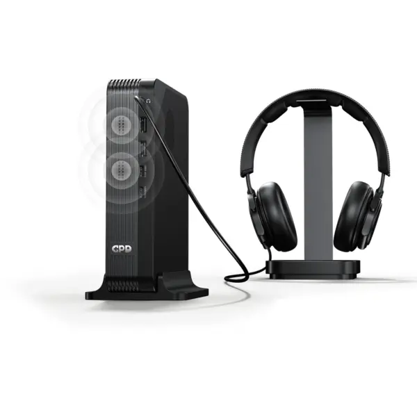 GPD BOX black ribbed GPD Mini PC front angled view with USB ports, antenna, and headphones on stand