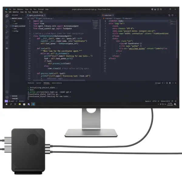 GPD BOX black textured mini PC with round vent, cabled to monitor showing Visual Studio Code