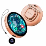 NIKKO-BADGE-TS-ORANGE-IMAGE-1-NEW-1 A orange electronic badge with a round screen showing a blue, green, and red anime-style girl is shown. The screen displays text that reads "1.8” IPS TOUCHSCREEN" and "JPG / PNG / GIFS 3S videos" with small red heart icons to its side. A metal clip is attached to the back of the device. The device is hanging on a gray string attached to another smaller round device that is black with a glowing blue, purple, and green pattern in the center. The overall shape and color of the devices are reminiscent of round watches.